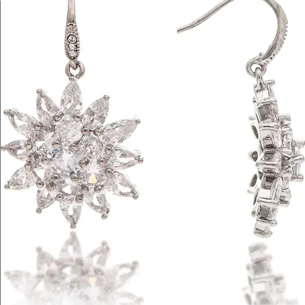Sparkle this season with these Starburst Hook Dangle Earrings RIVKA FRIEDMAN